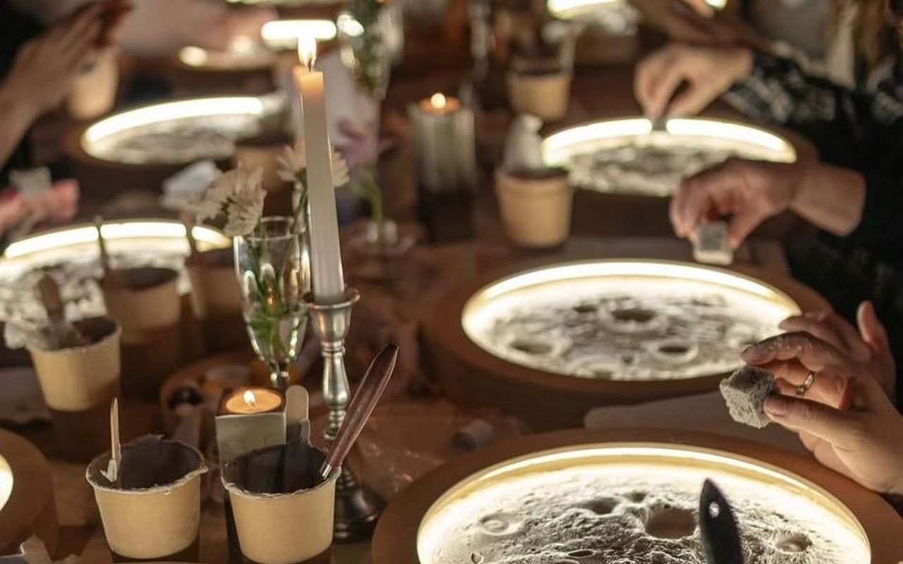 A lively evening session with glowing moon lamps and candles
